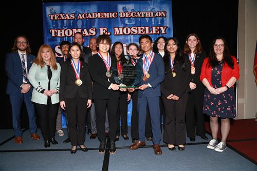 2023 TX State Champ team holding trophy